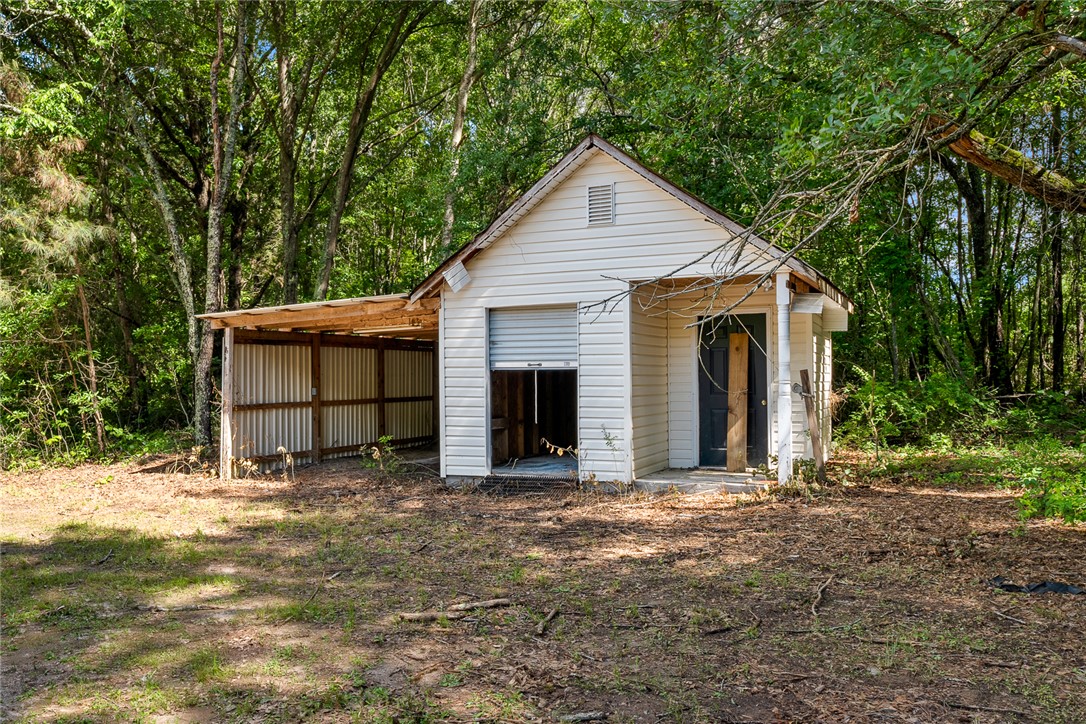 131 Lockaby Road Pelzer, SC 29669 - Photo 36 of 50 This structure is nestled among trees, offering a private setting.