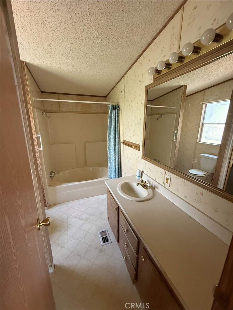 2658 Brougham Drive Oroville, CA 95966 - Photo 14 of 23 a bathroom with a sink and a mirror
