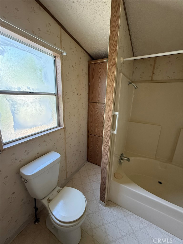 2658 Brougham Drive Oroville, CA 95966 - Photo 15 of 23 a bathroom with a toilet and a shower