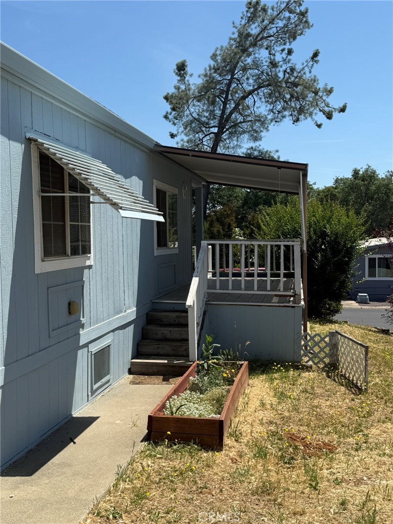2658 Brougham Drive Oroville, CA 95966 - Photo 23 of 23 a view of a balcony with chairs potted plants and large tree