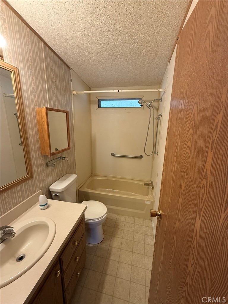 2658 Brougham Drive Oroville, CA 95966 - Photo 10 of 23 a bathroom with a sink a toilet and shower a mirror