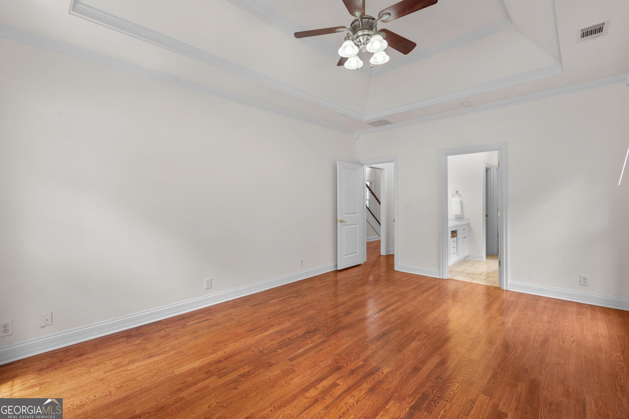 155 Rocky Way Williamson, GA 30292 - Photo 11 of 47 a view of an empty room with wooden floor