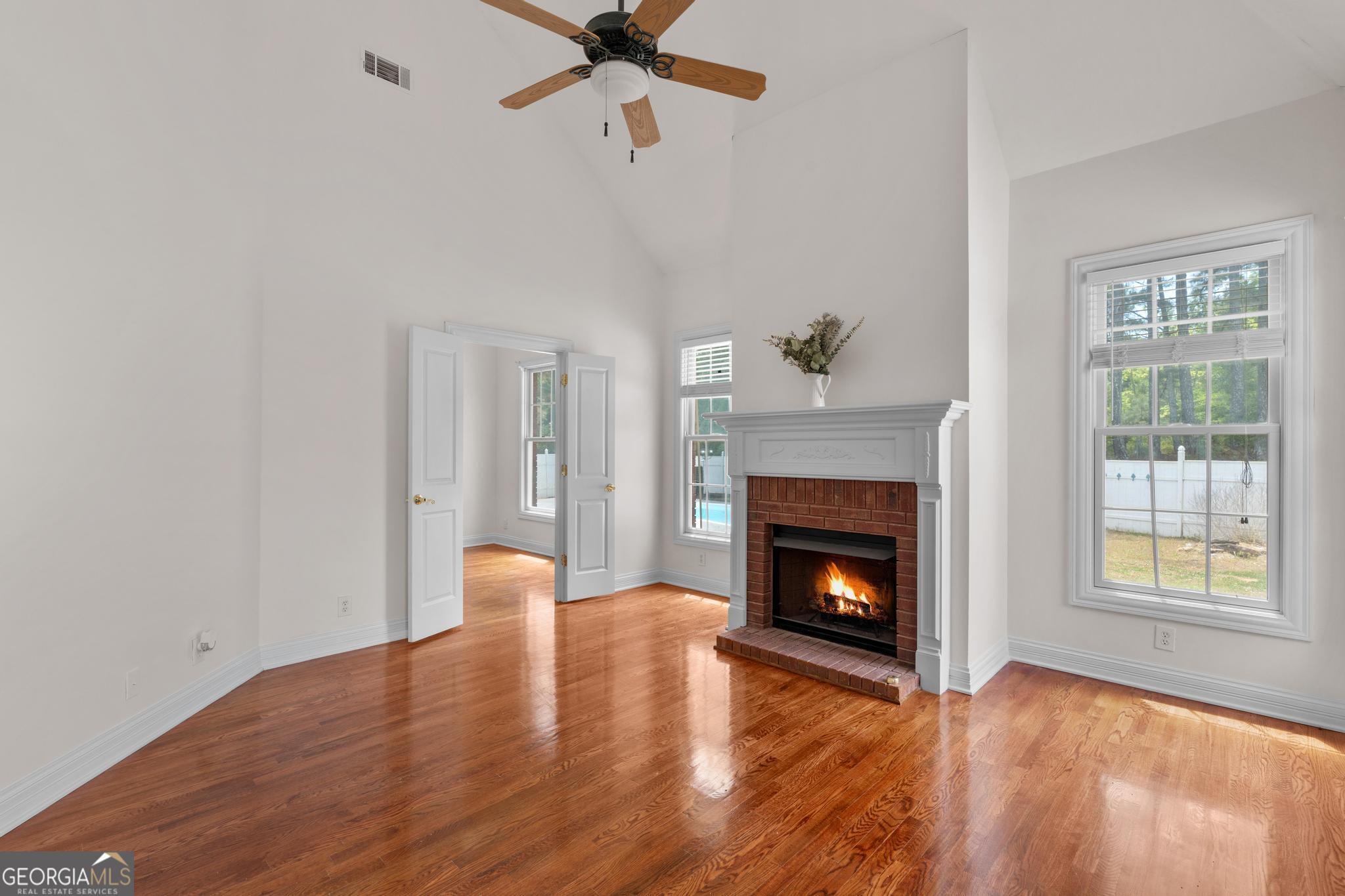 155 Rocky Way Williamson, GA 30292 - Photo 17 of 47 a living room with furniture and a fireplace