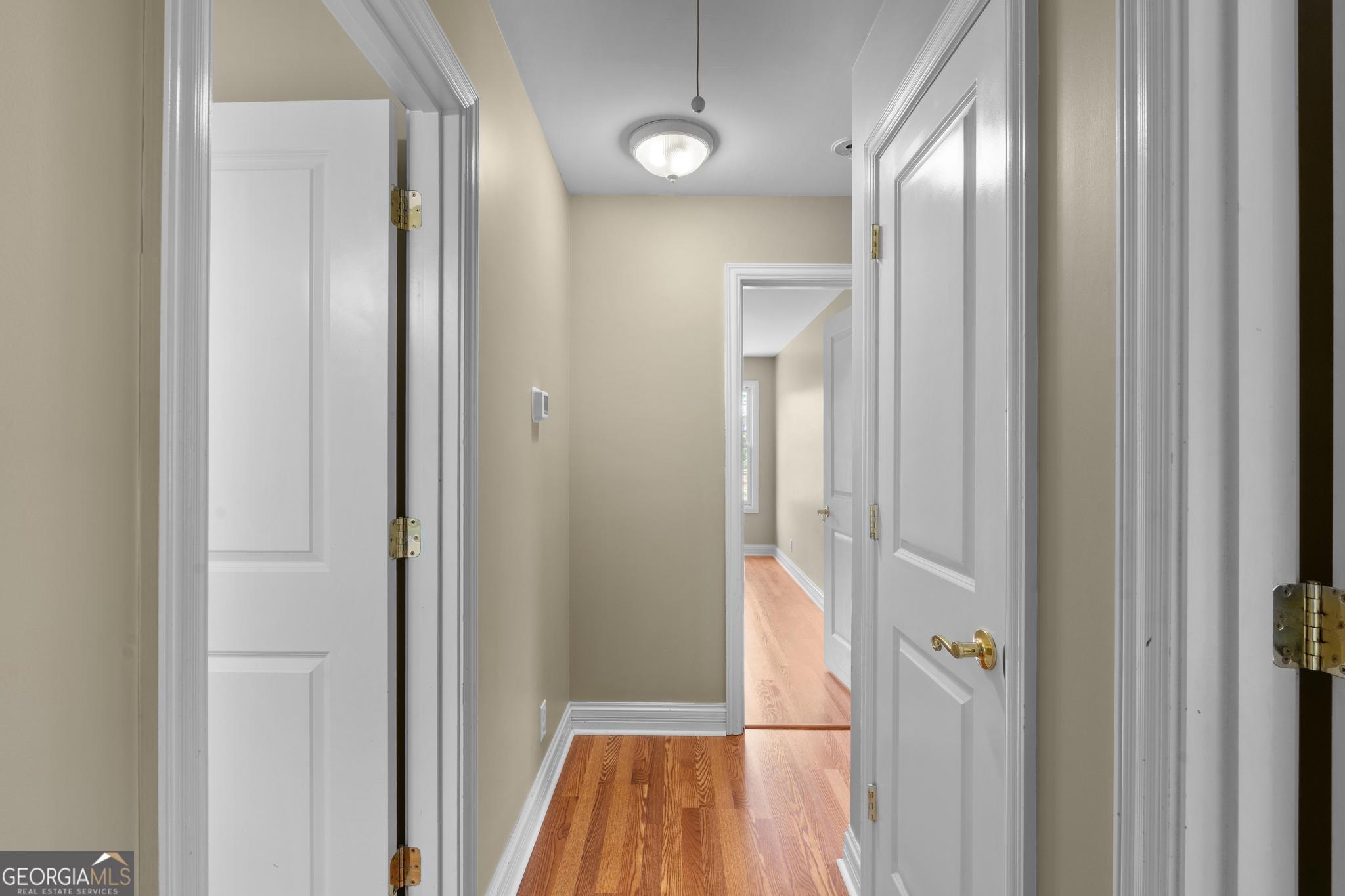 155 Rocky Way Williamson, GA 30292 - Photo 24 of 47 a view of a hallway with wooden floor