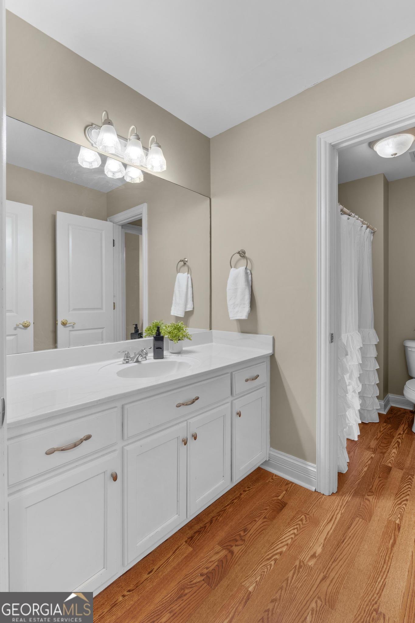 155 Rocky Way Williamson, GA 30292 - Photo 27 of 47 a spacious bathroom with double vanity sink and a mirror