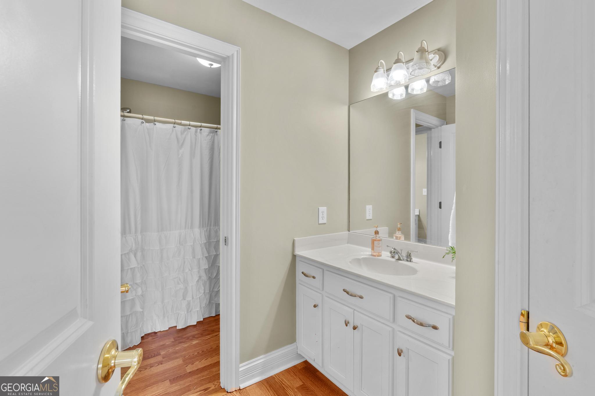 155 Rocky Way Williamson, GA 30292 - Photo 28 of 47 a bathroom with a sink vanity and a mirror