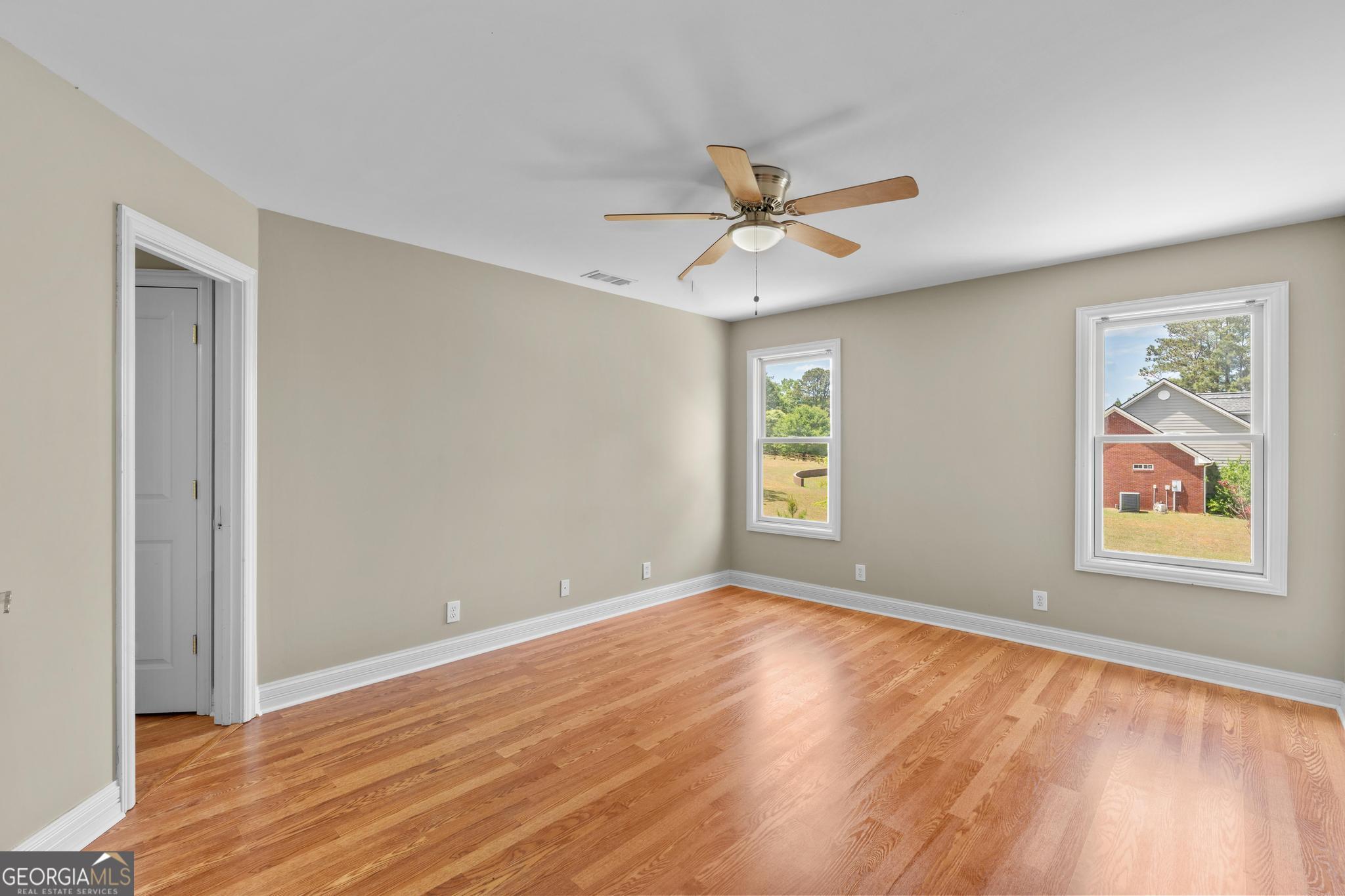 155 Rocky Way Williamson, GA 30292 - Photo 30 of 47 wooden floor in an empty room with a window