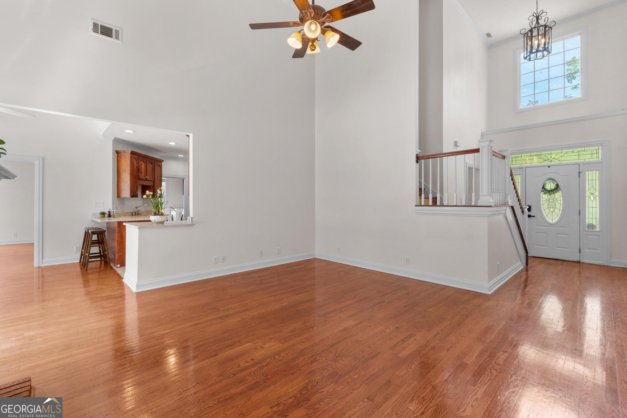 155 Rocky Way Williamson, GA 30292 - Photo 3 of 47 wooden floor in an empty room with a window