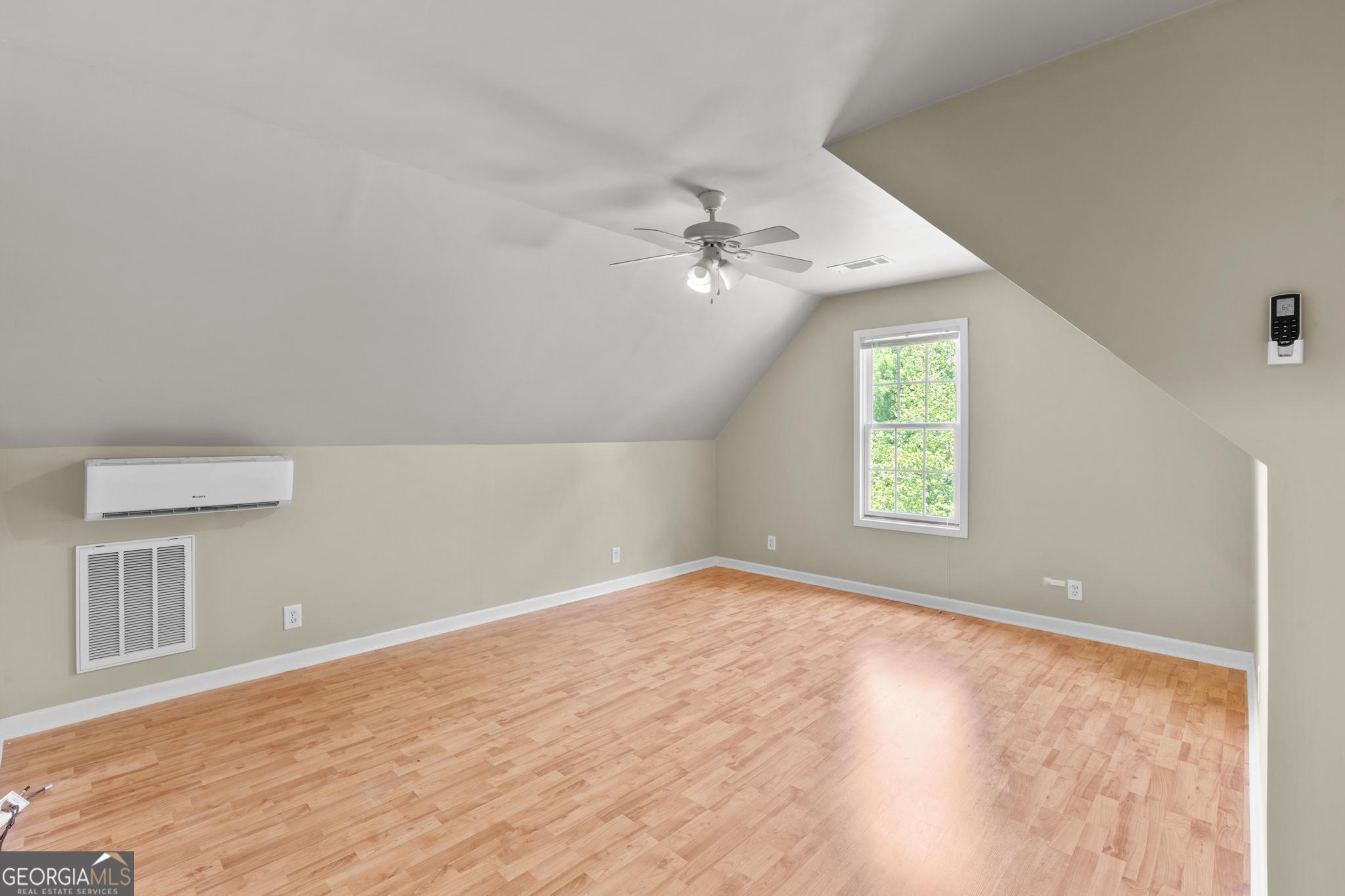 155 Rocky Way Williamson, GA 30292 - Photo 32 of 47 an empty room with windows and ceiling fan