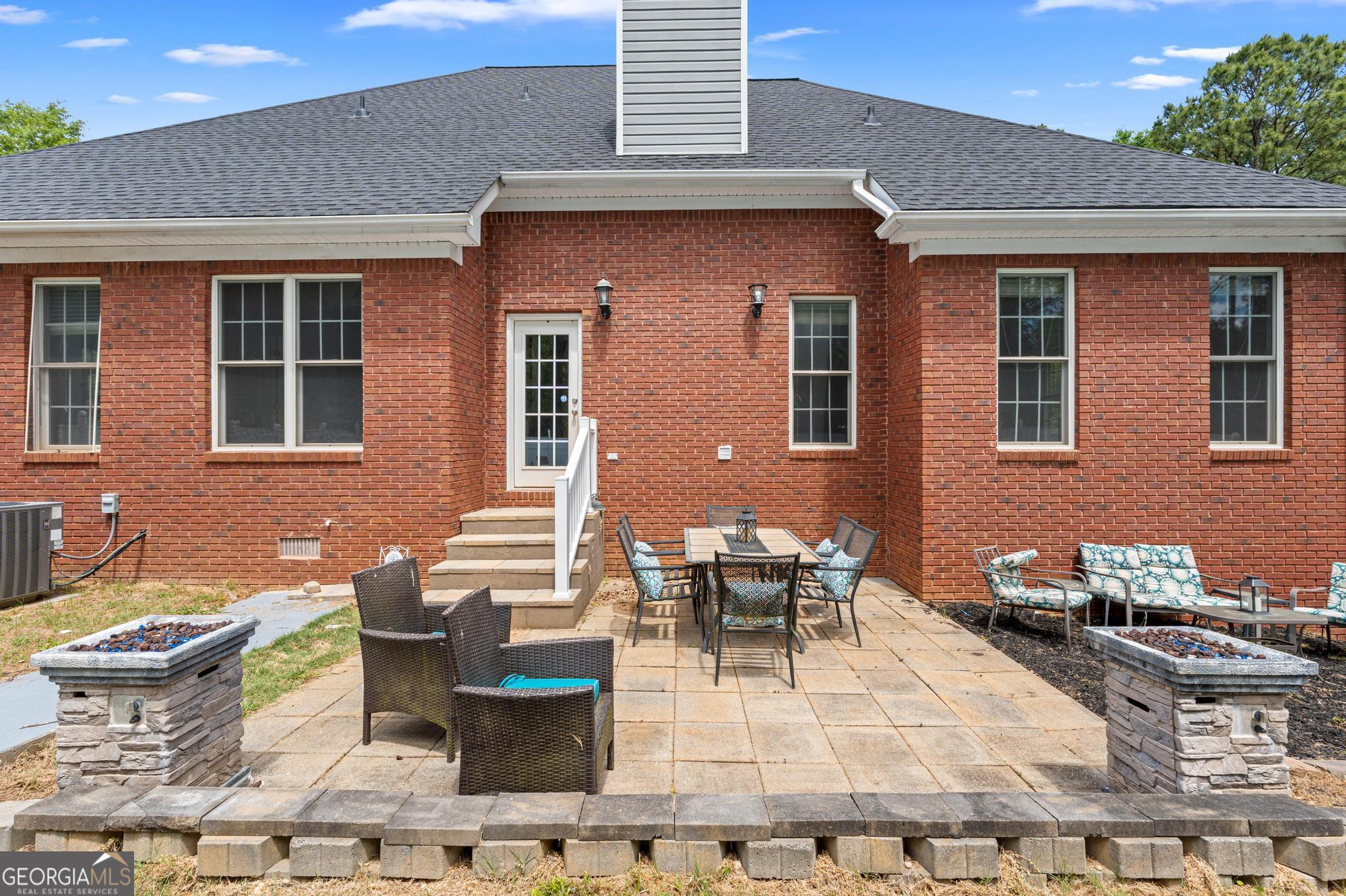 155 Rocky Way Williamson, GA 30292 - Photo 41 of 47 a view of a patio with couches and potted plants