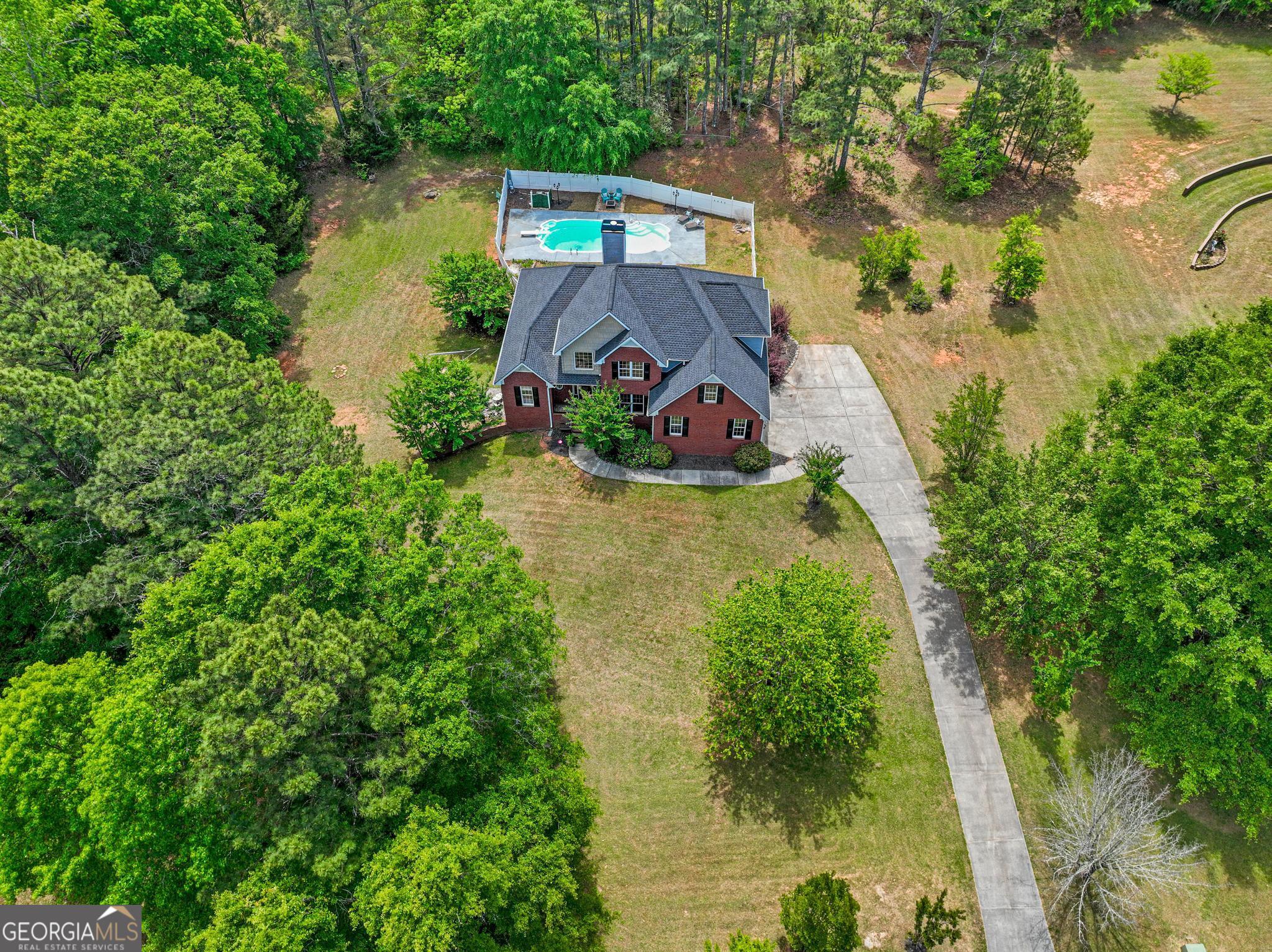 155 Rocky Way Williamson, GA 30292 - Photo 46 of 47 an aerial view of a house with a yard basket ball court and outdoor seating
