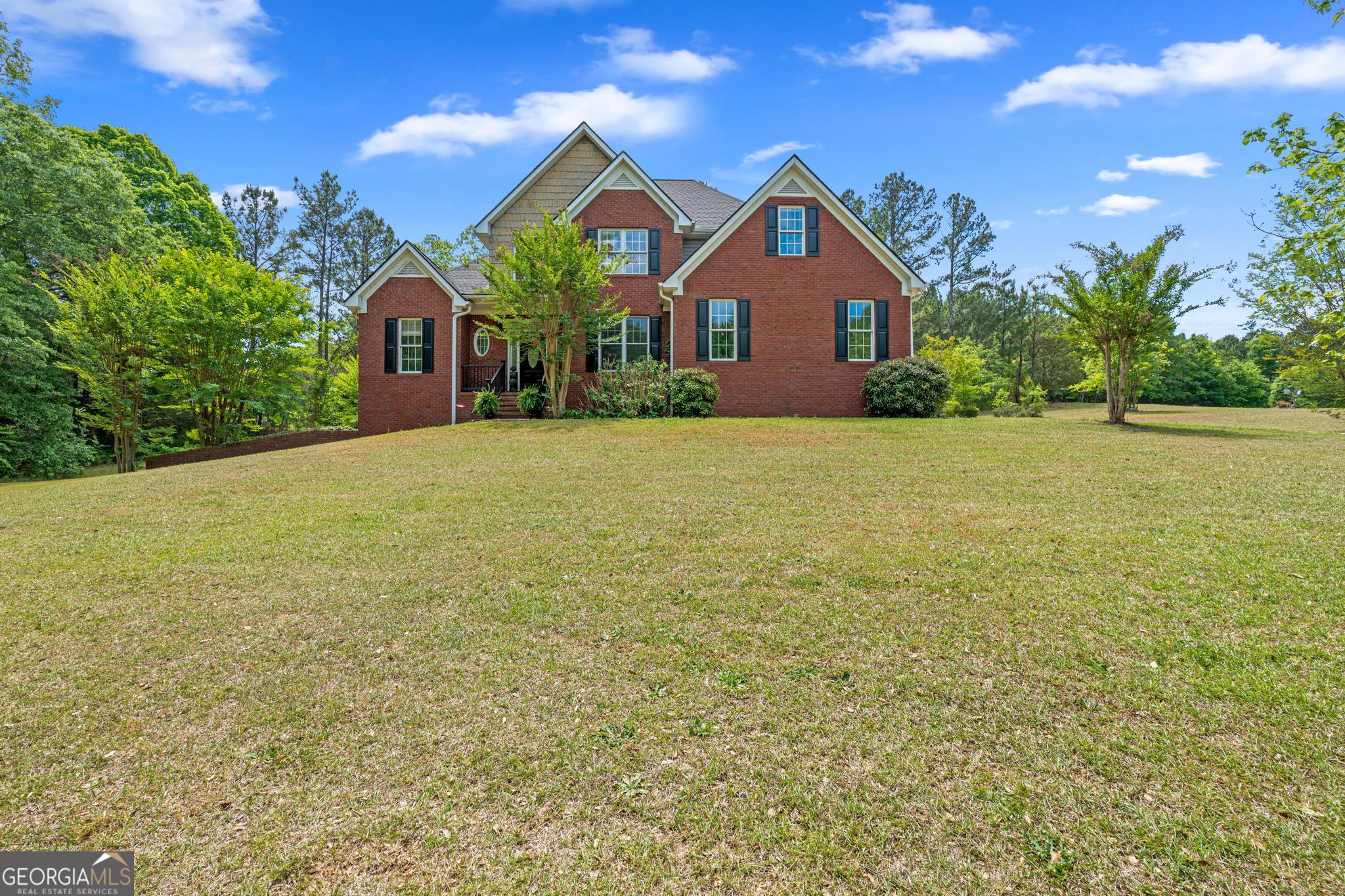 155 Rocky Way Williamson, GA 30292 - Photo 47 of 47 a front view of a house with a yard and trees