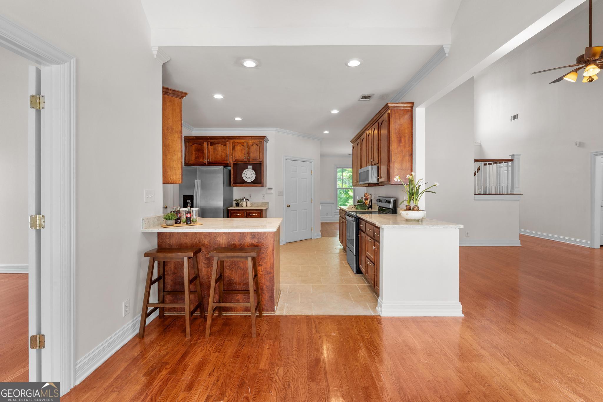 155 Rocky Way Williamson, GA 30292 - Photo 6 of 47 a kitchen with a sink cabinets and wooden floor