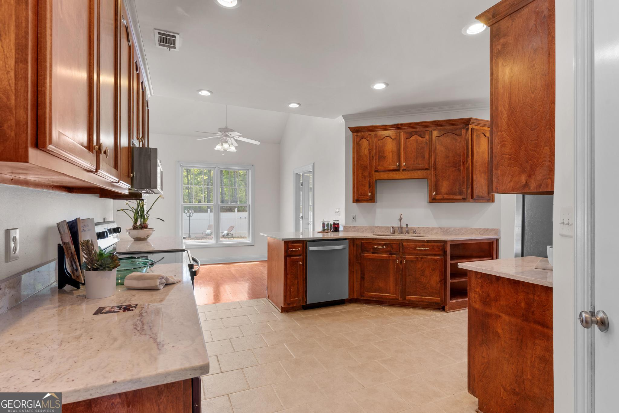 155 Rocky Way Williamson, GA 30292 - Photo 8 of 47 a large kitchen with granite countertop lots of counter top space