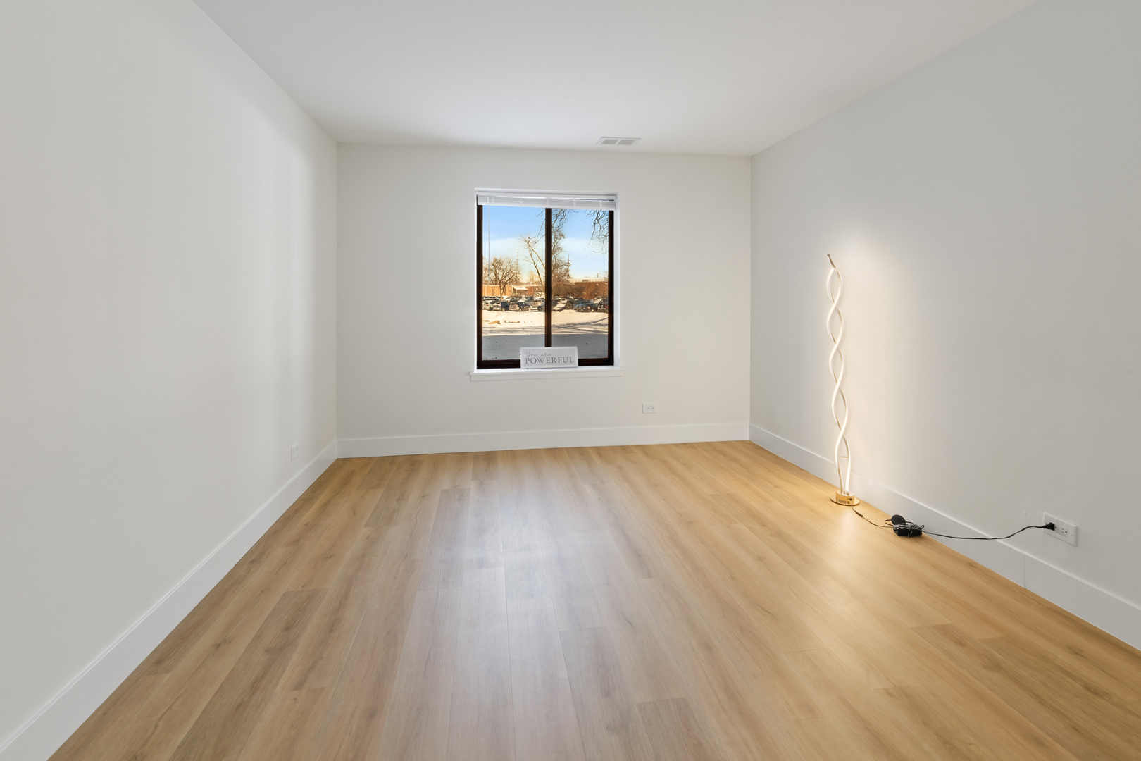 830 Elder Road, Unit B104 Homewood, IL 60430 - Photo 14 of 19 an empty room with wooden floor and windows