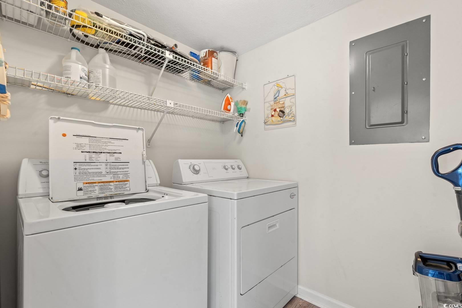 5507 North Ocean Boulevard, Unit 113 Myrtle Beach, SC 29577 - Photo 15 of 28 Washroom featuring electric panel and washing machine and clothes dryer