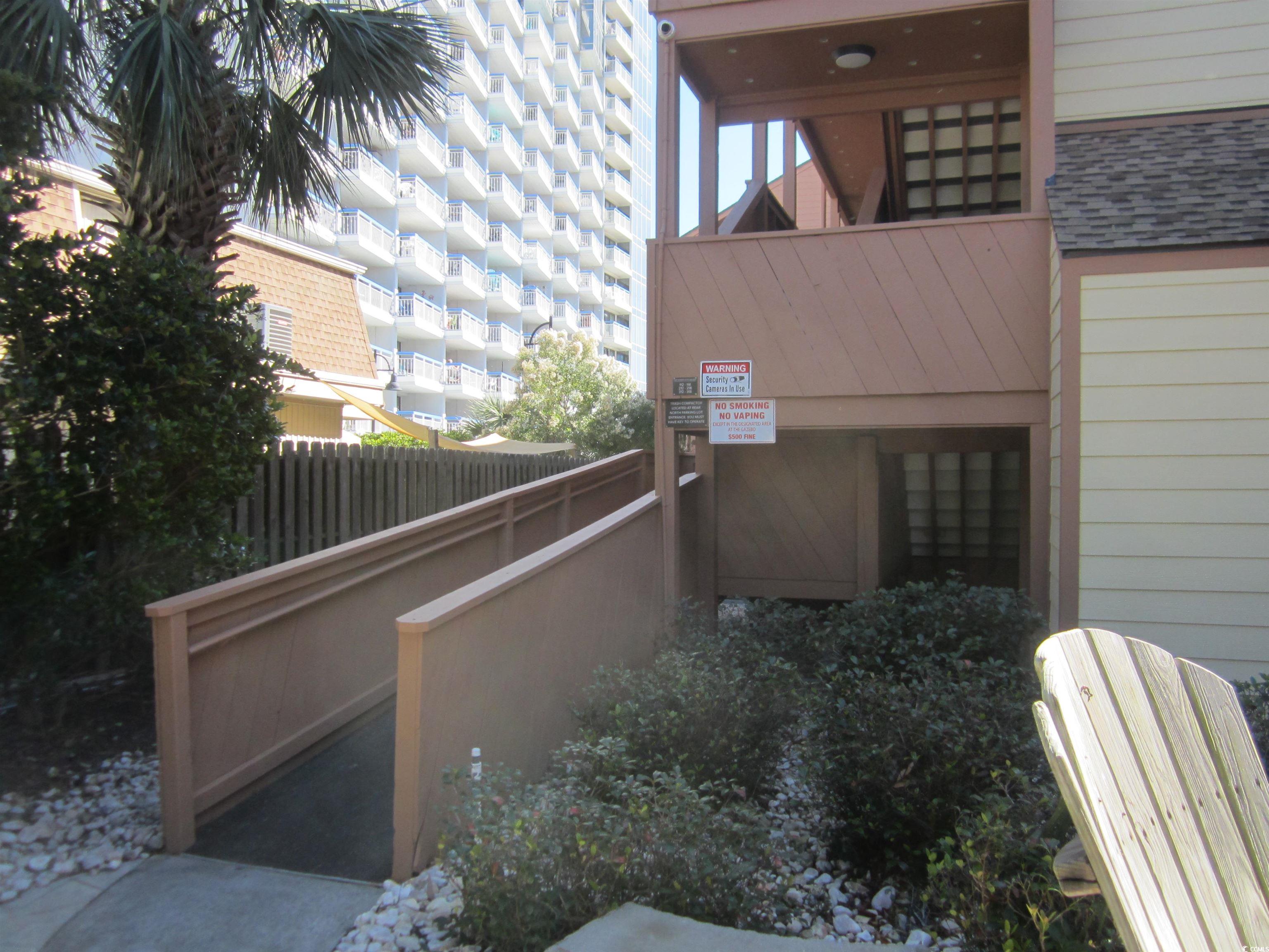 5507 North Ocean Boulevard, Unit 113 Myrtle Beach, SC 29577 - Photo 24 of 28 View of side of home featuring a shingled roof