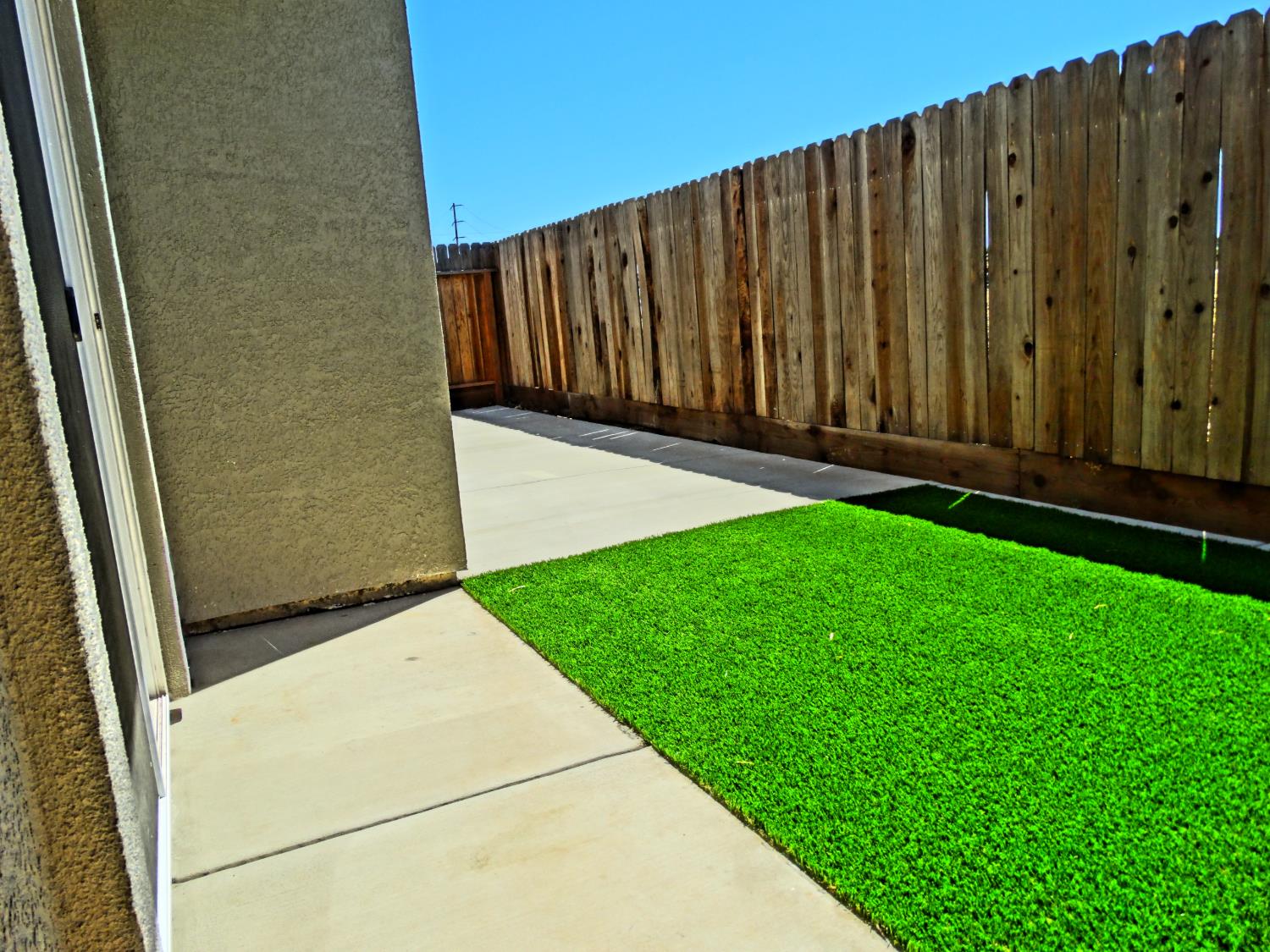 683 Granada Court Merced, CA 95341 - Photo 8 of 9 a view of outdoor space with wooden wall