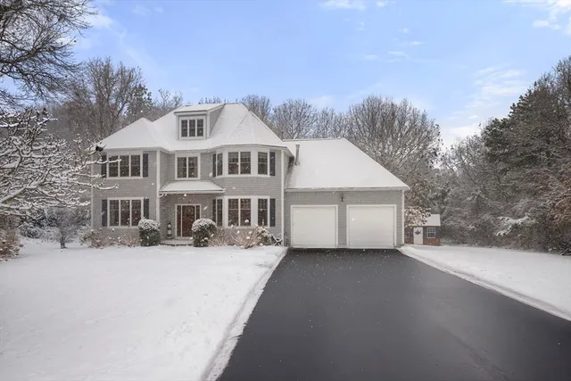 a view of a house with a snow in the yard