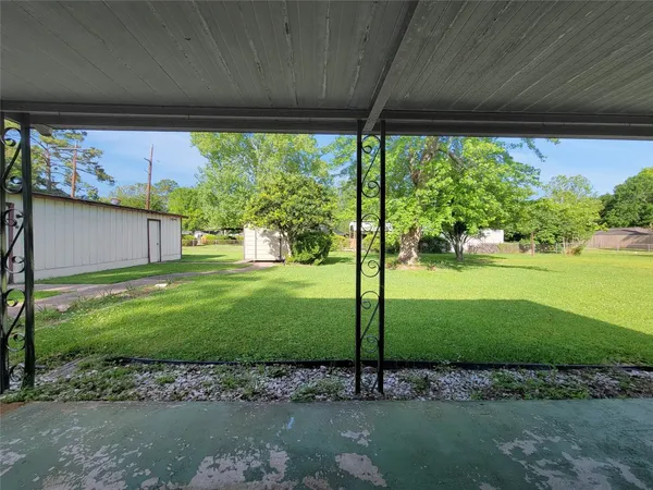 a view of a back yard from a room