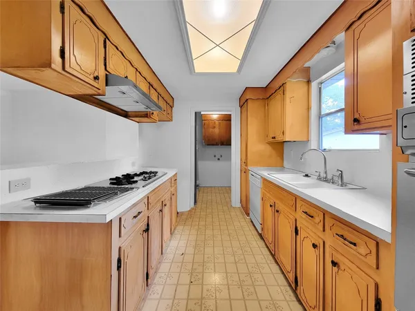 a kitchen with stainless steel appliances granite countertop a stove and a sink