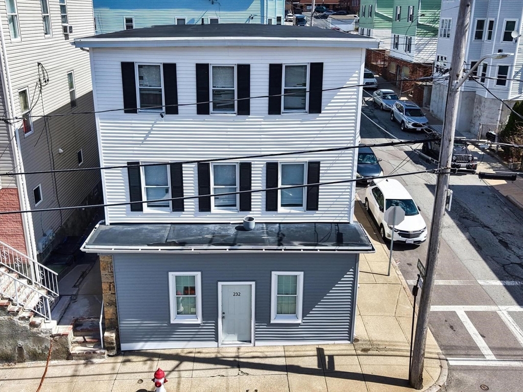 232 Alden Street Fall River, MA 02723 - Photo 33 of 34 a front view of a house with glass windows