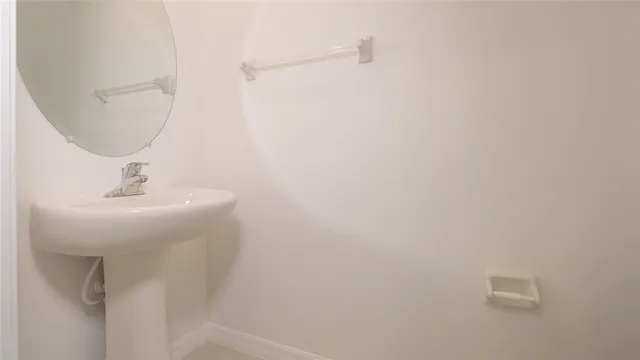 an empty room with a bathroom