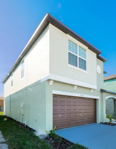 a backyard of a house with large trees