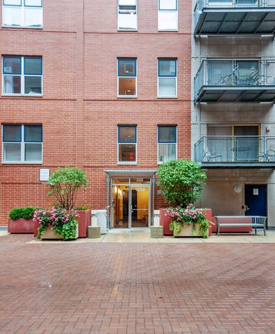 a front view of a building with a yard