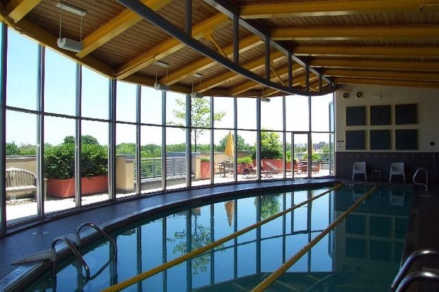 a view of a patio with table and chairs potted plants with wooden fence