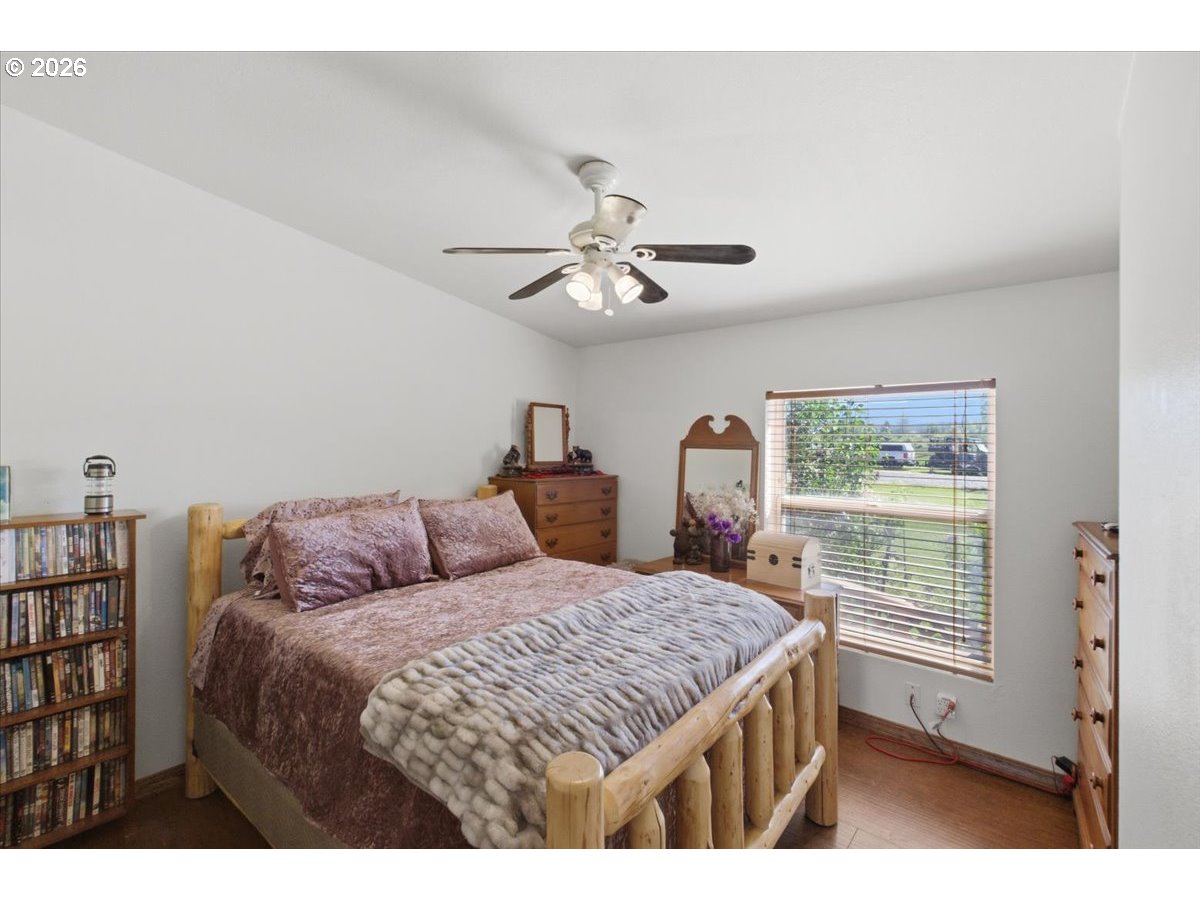 35377 Ede Road Lebanon, OR 97355 - Photo 22 of 48 a living room with a bed furniture and a window
