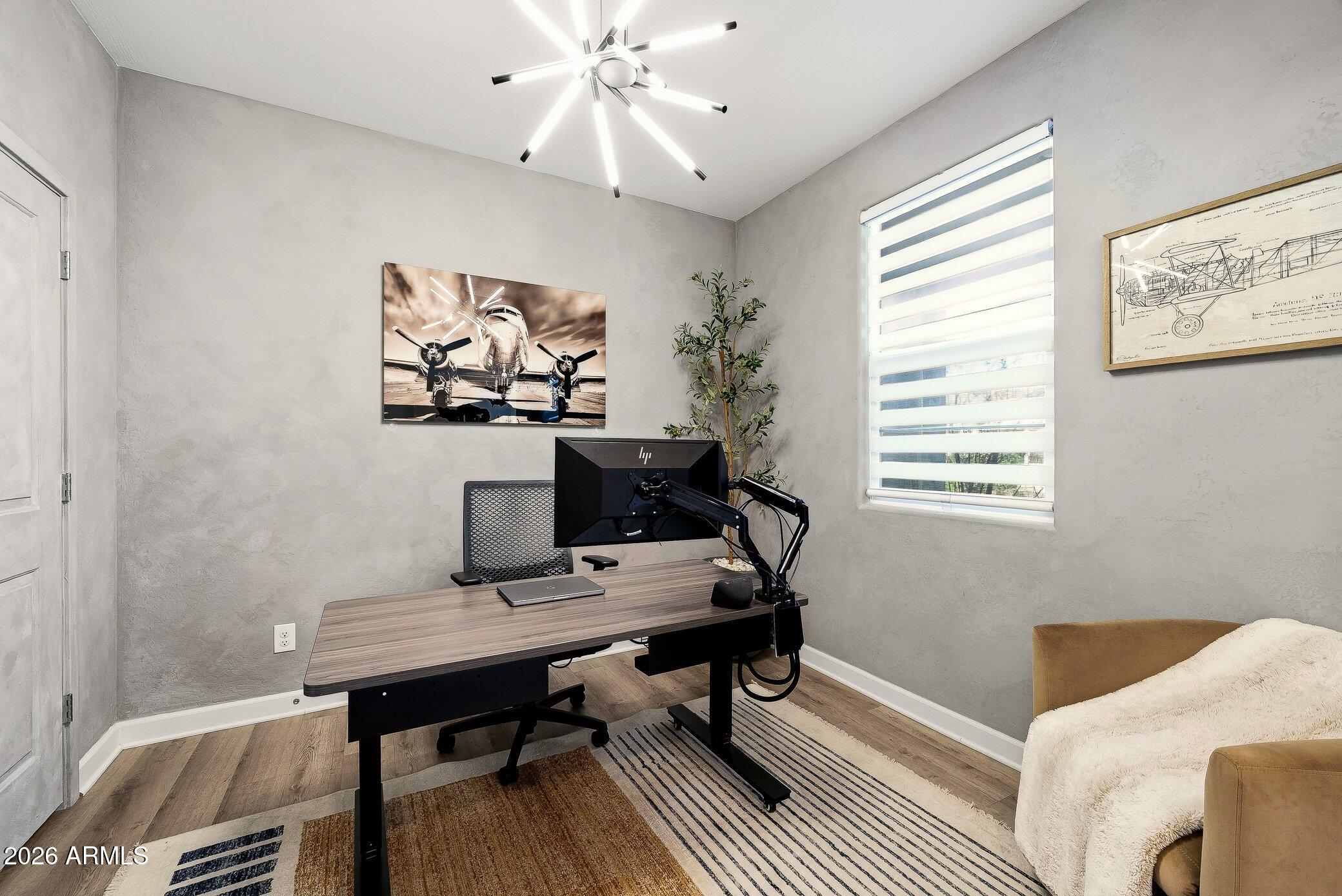 35032 North Barrel Road Queen Creek, AZ 85144 - Photo 11 of 40 a view of a workspace with furniture and a window