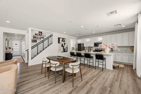 a living room with furniture and a painting