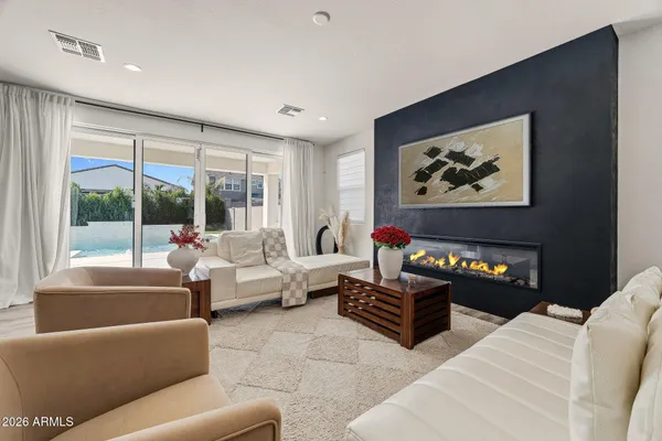 a living room with furniture and a large window