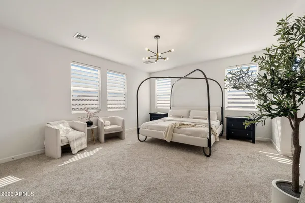 a living room with furniture and potted plant