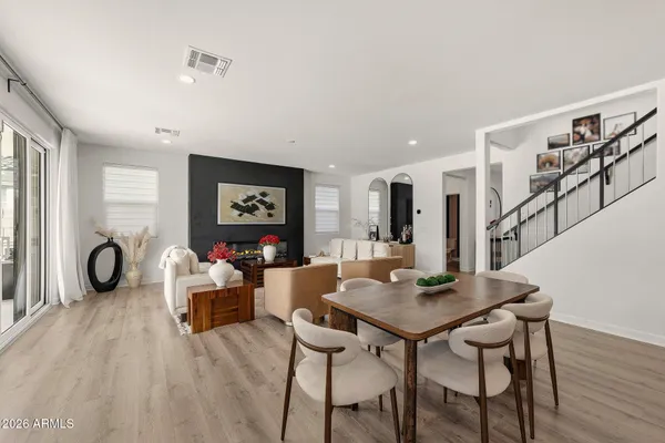 a kitchen with stainless steel appliances granite countertop a sink a stove and a refrigerator