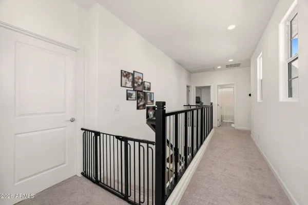 a bed room with a bed and a large window