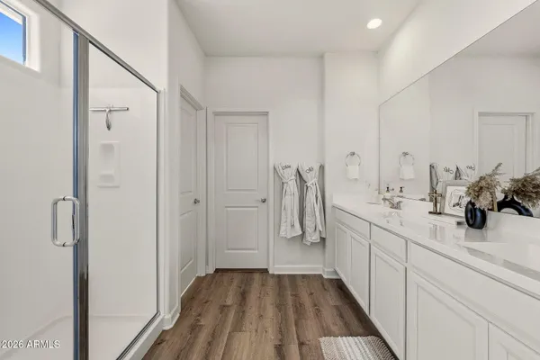 a bathroom with a double vanity sink and mirror