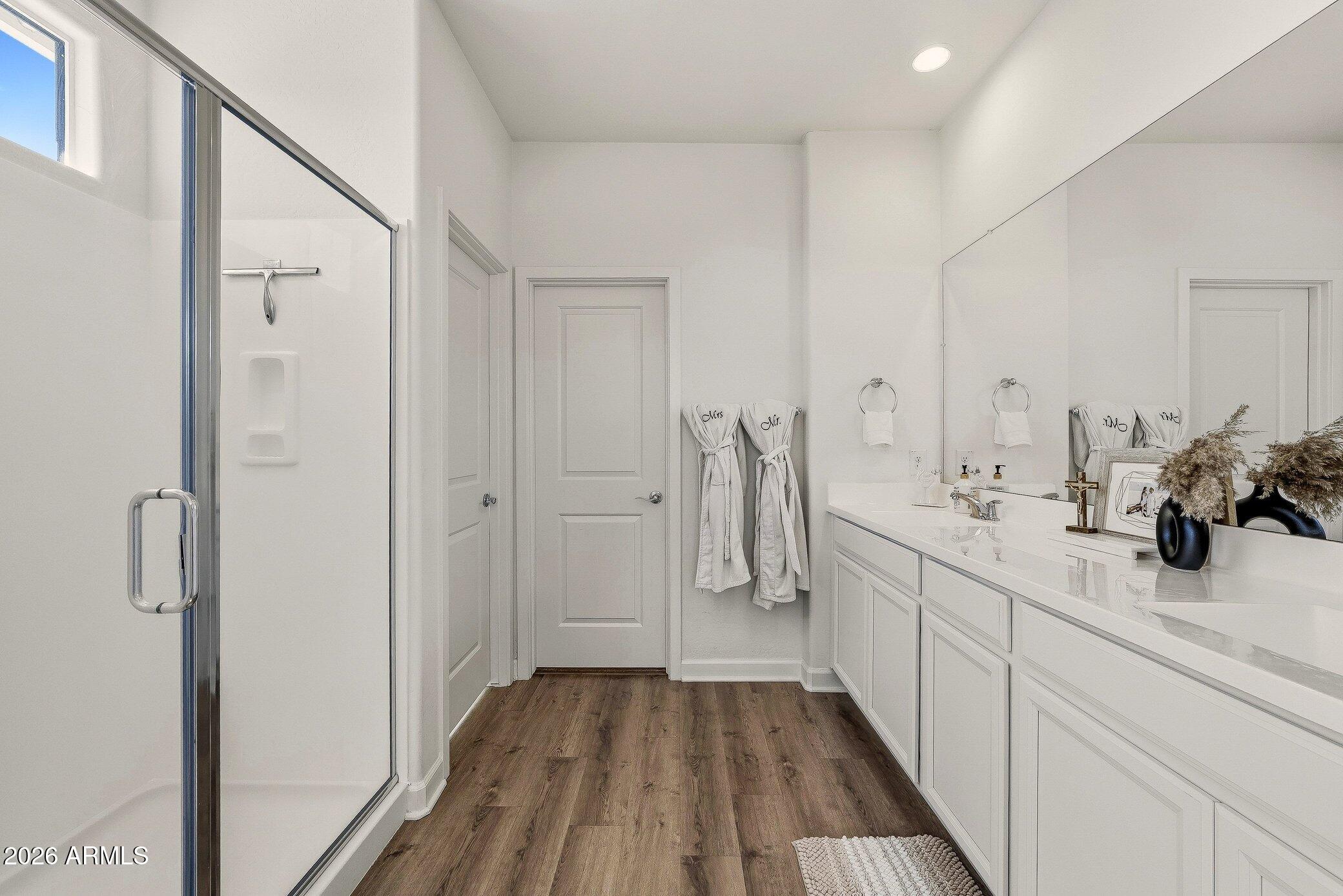 35032 North Barrel Road Queen Creek, AZ 85144 - Photo 27 of 40 a bathroom with a double vanity sink and mirror