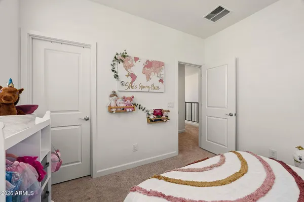 a bed room with a bed and a large window