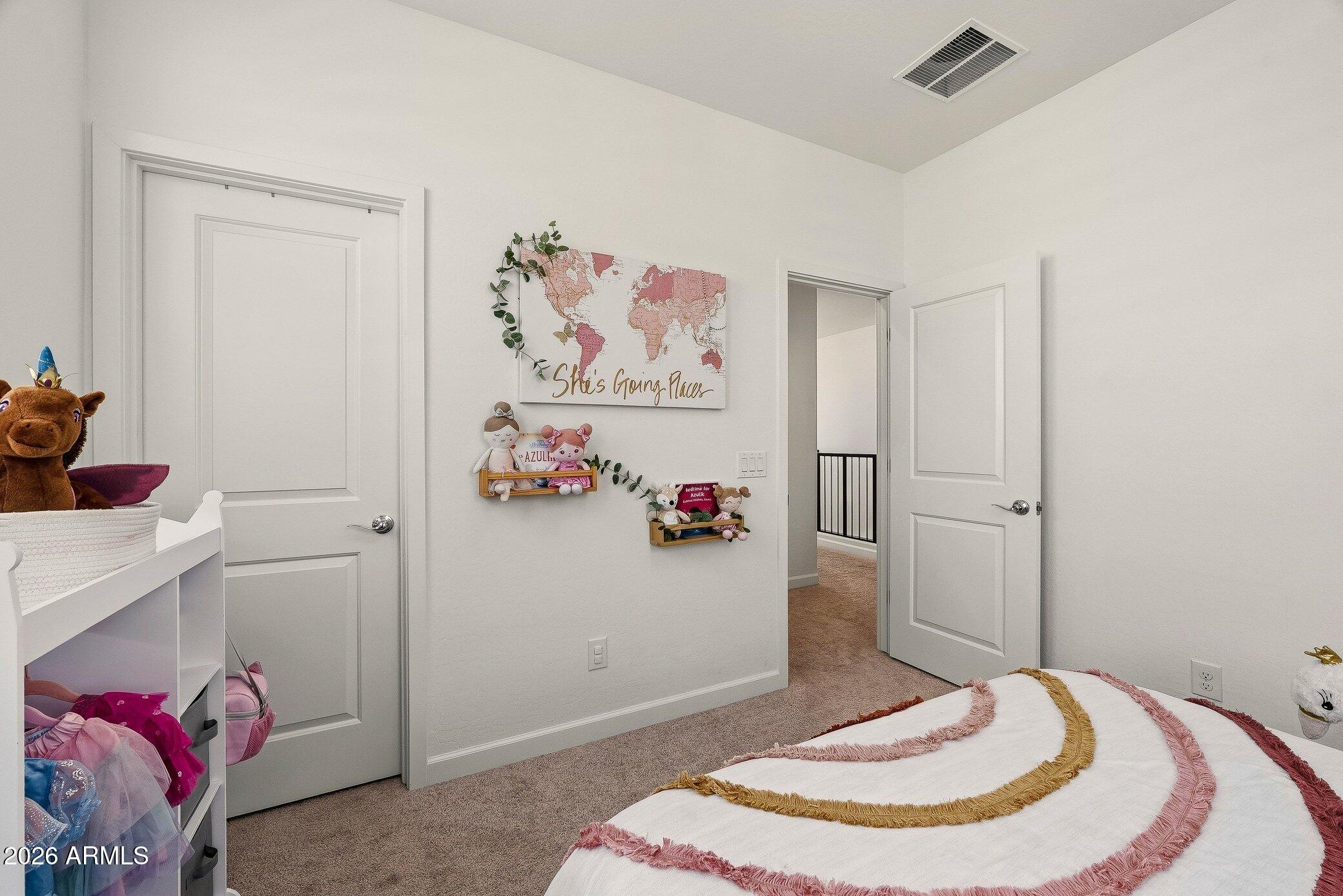 35032 North Barrel Road Queen Creek, AZ 85144 - Photo 32 of 40 a bedroom with a bed and wooden floor