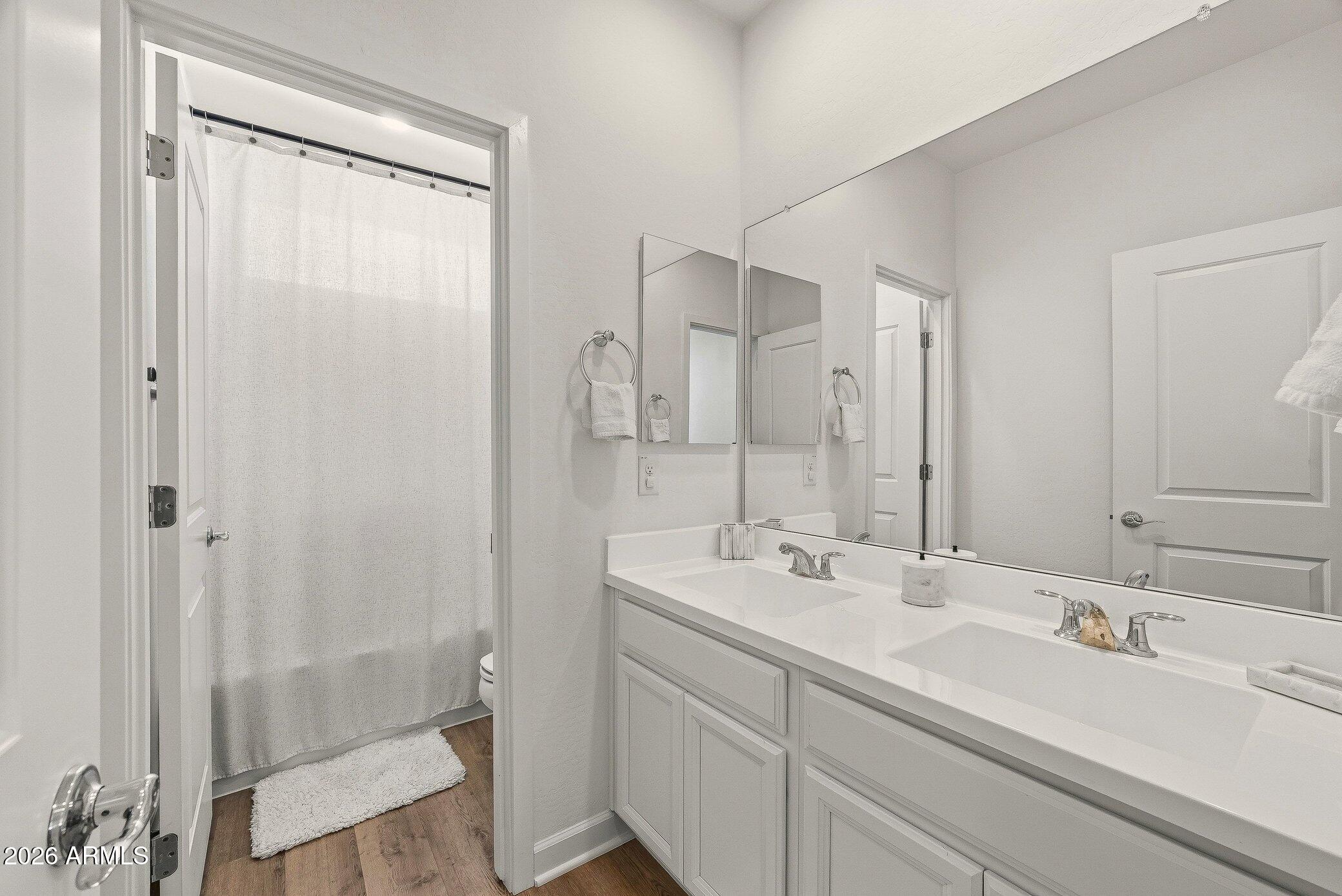 35032 North Barrel Road Queen Creek, AZ 85144 - Photo 33 of 40 a bathroom with a double vanity sink mirror and double
