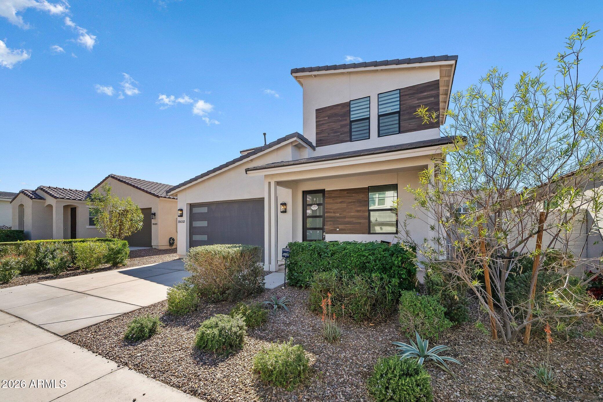 35032 North Barrel Road Queen Creek, AZ 85144 - Photo 3 of 40 a view of a house with a yard and plants