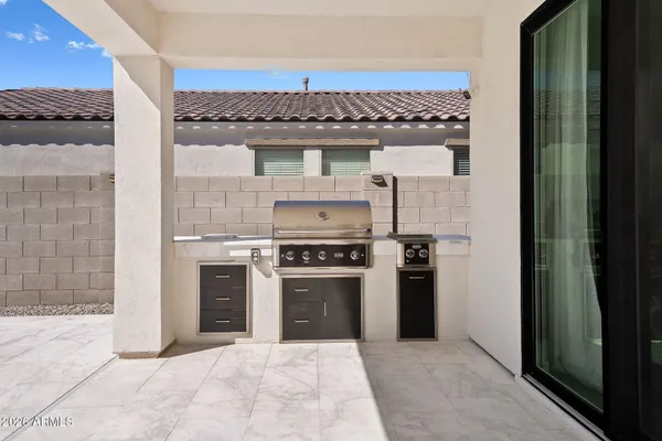 a kitchen with stainless steel appliances granite countertop a stove and a refrigerator