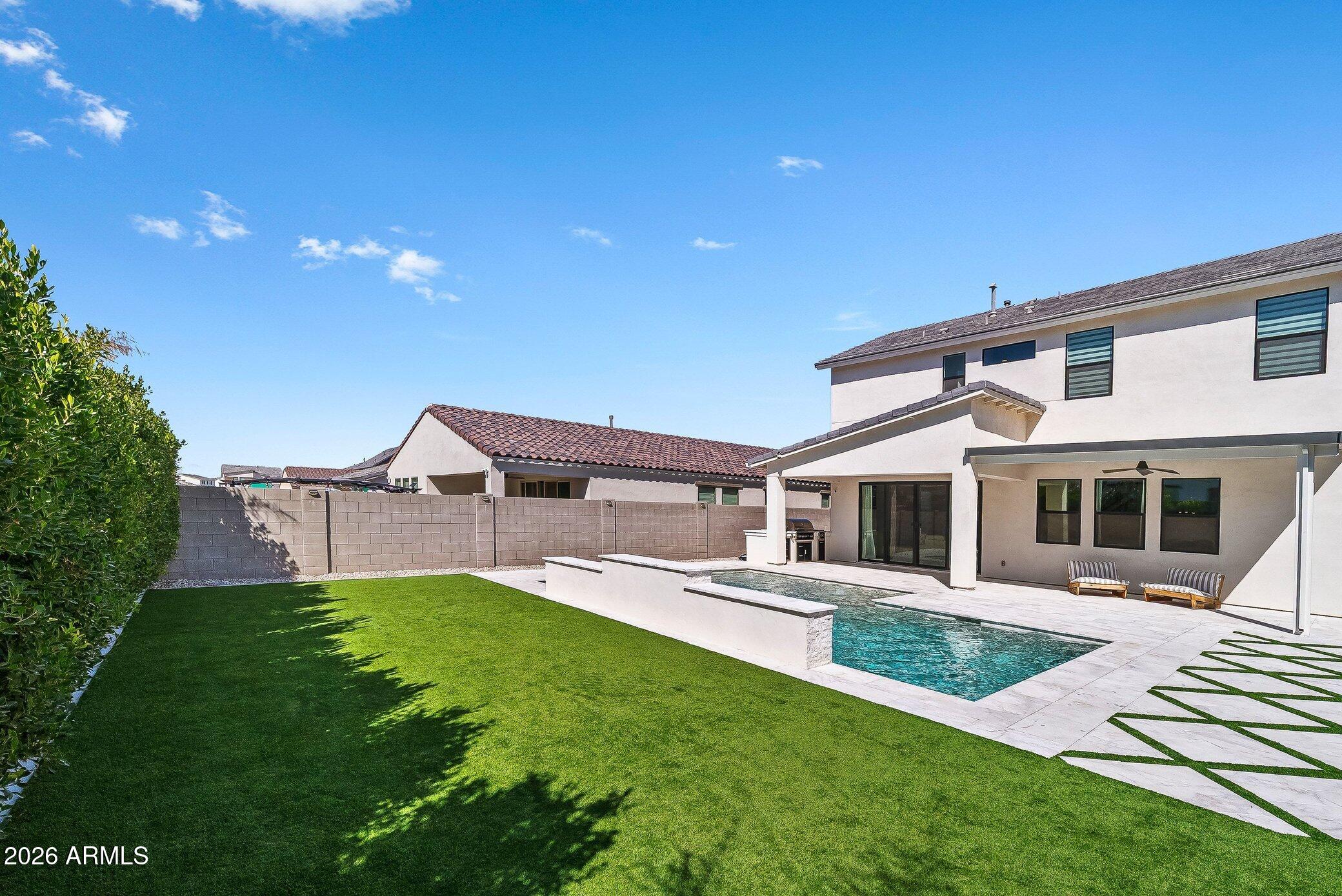 35032 North Barrel Road Queen Creek, AZ 85144 - Photo 6 of 40 a front view of a house with a yard