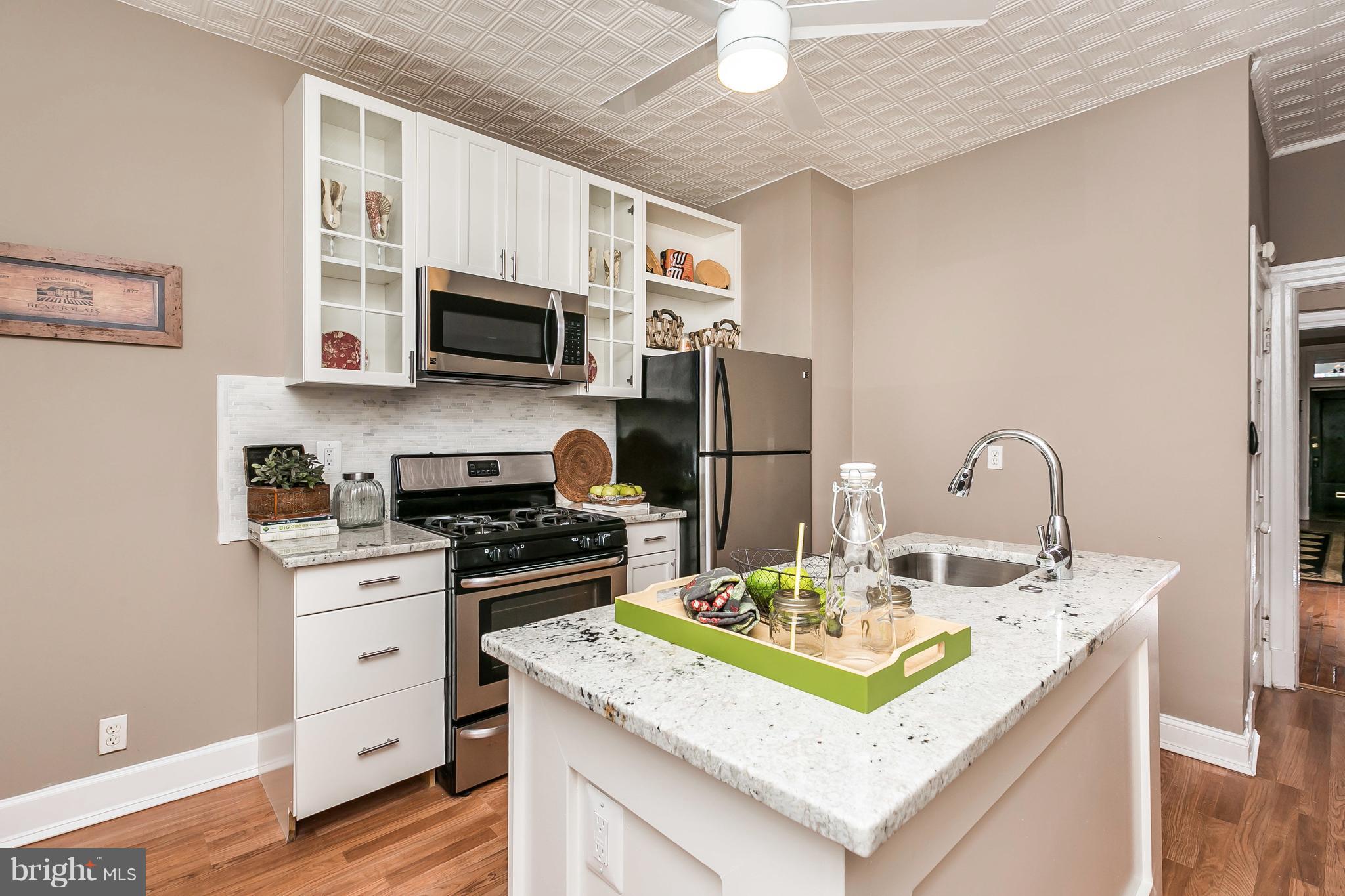 4024 Roland Avenue Baltimore, MD 21211 - Photo 11 of 28 New Kitchen with SS Appliances, Granite and Island