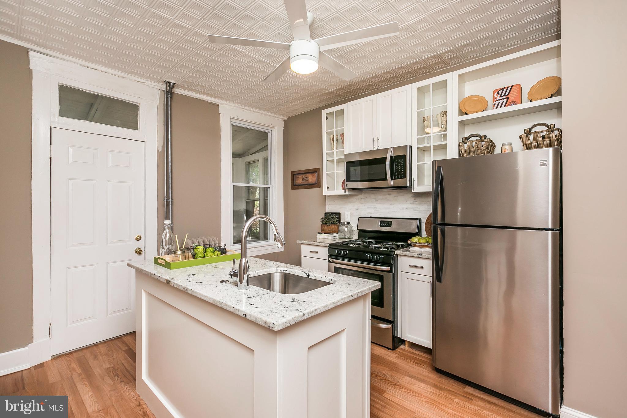 4024 Roland Avenue Baltimore, MD 21211 - Photo 9 of 28 New Kitchen with SS Appliances, Granite and Island