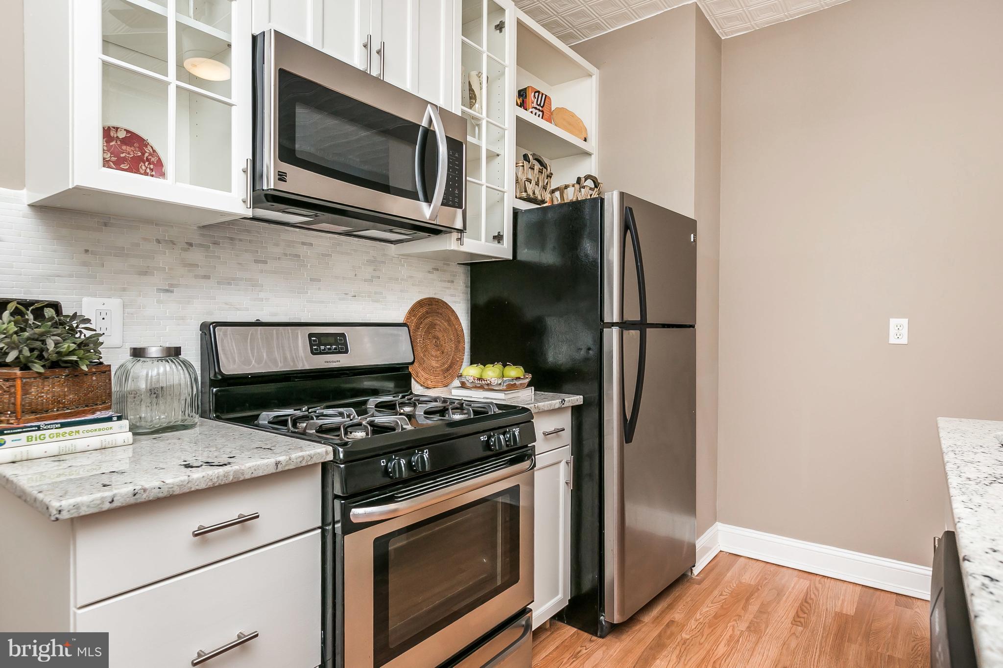 4024 Roland Avenue Baltimore, MD 21211 - Photo 10 of 28 New Kitchen with SS Appliances, Granite and Island