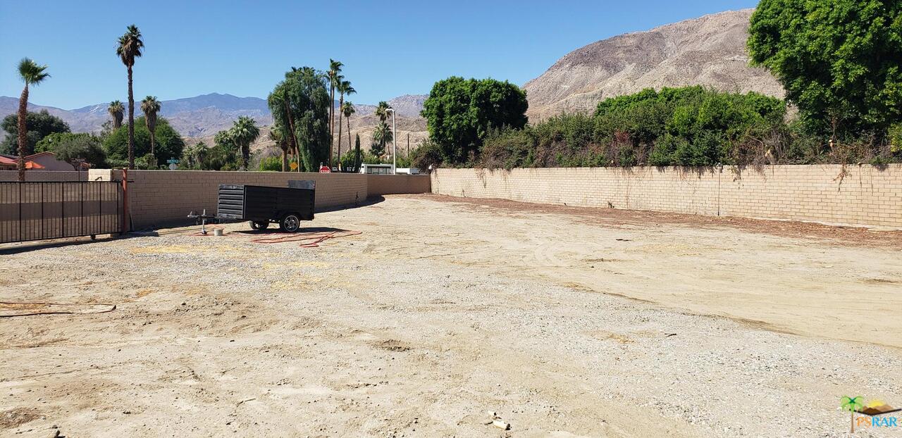 0 Joshua Road Rancho Mirage, CA 92270 - Photo 5 of 9 a view of a white house with a yard