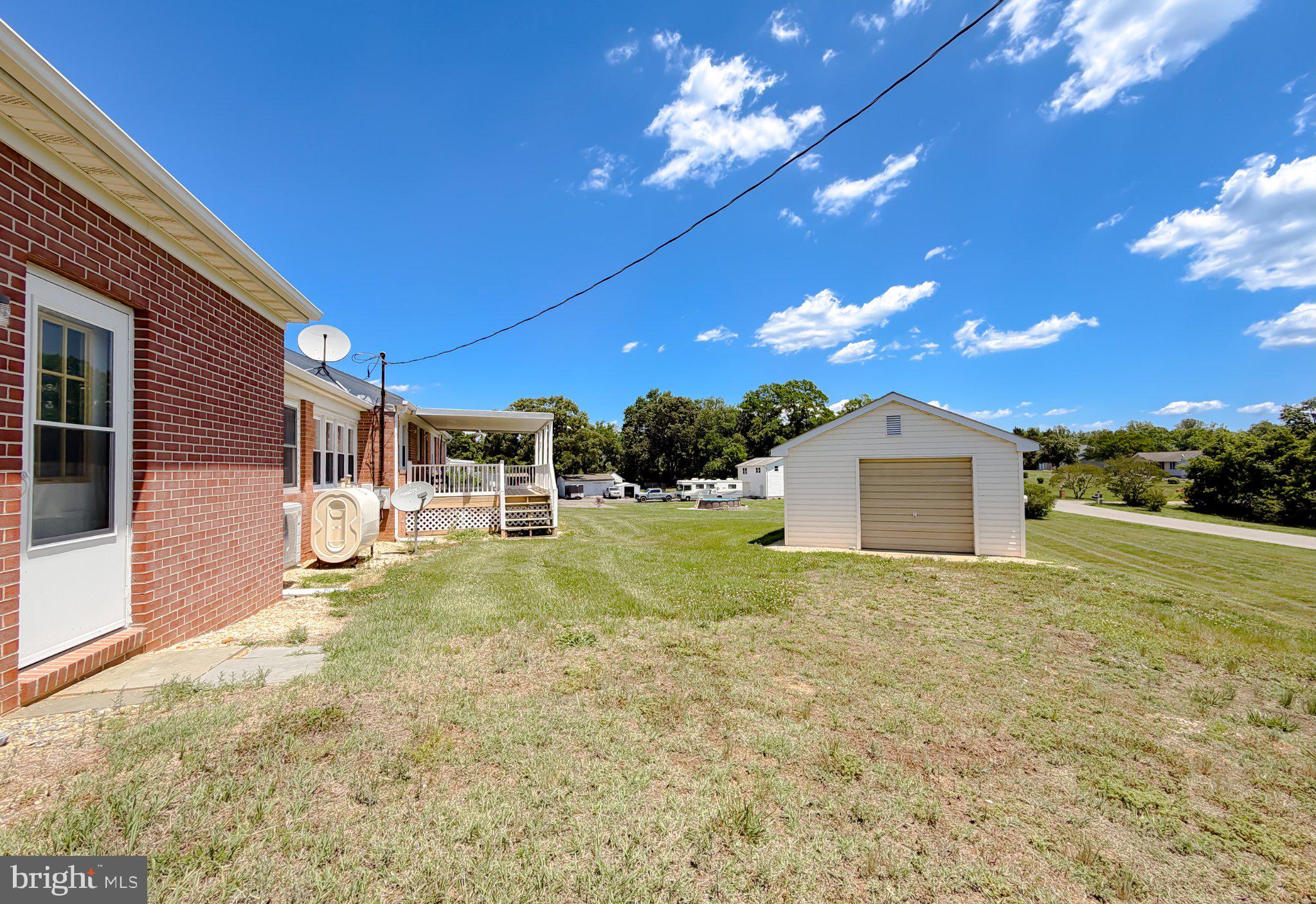 23230 Colton Point Road Avenue, MD 20609 - Photo 3 of 63 Spacious yard with serene skies.